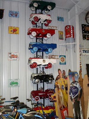 [vertical display of 8 pedal cars.]